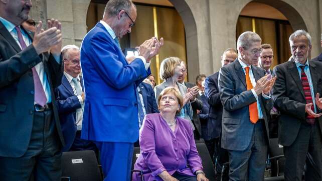 Merkel contra Merz bei Migrations-Wahlkampf